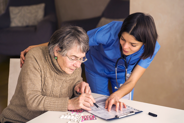 the document is offered by a young woman to a doctor the document is offered by a young woman to a doctor
