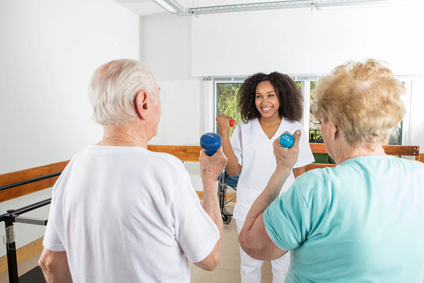 elder couple making exercises in rehab elder couple making exercises in rehab