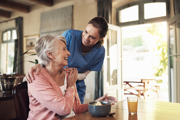 food helping nurse senior woman assisted living