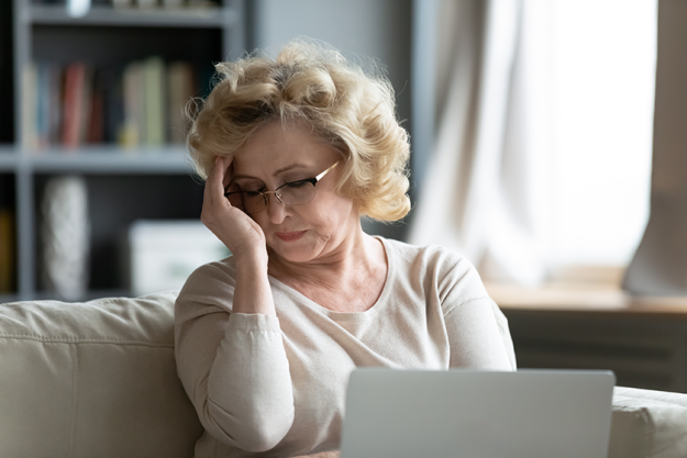 frustrated mature woman wearing glasses touching forehead frustrated mature woman wearing glasses touching forehead