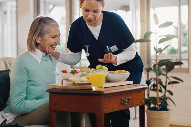 senior woman nurse breakfast