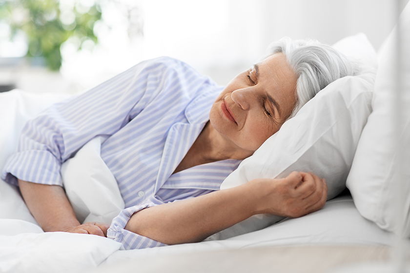 senior woman sleeping in bed