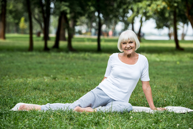 happy senior woman relaxing yoga