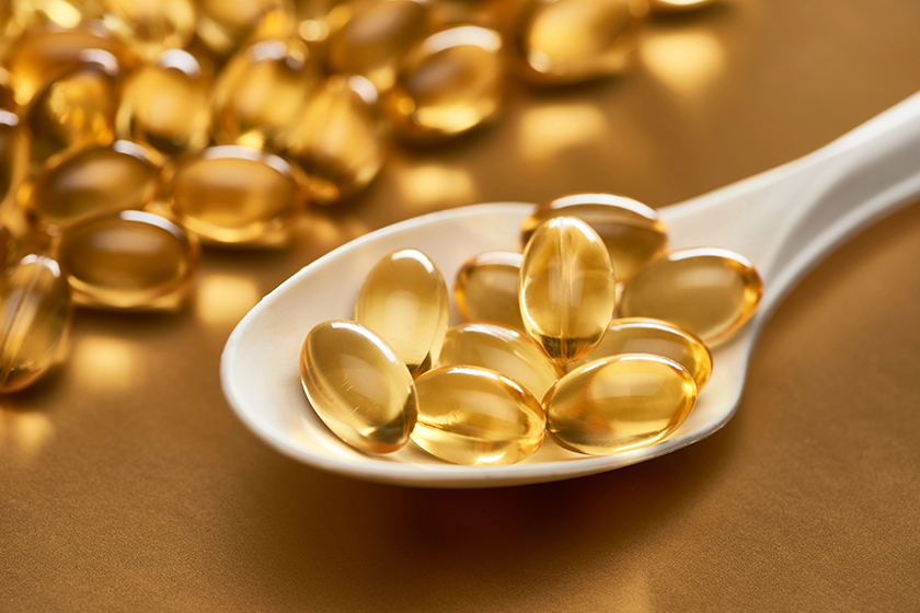 close view shiny fish oil capsules close view shiny fish oil capsules