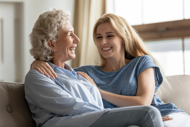 happy young woman embracing shoulders