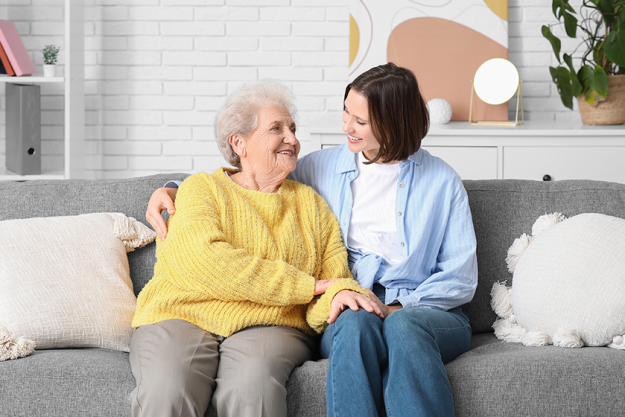 young nurse senior woman hugging young nurse senior woman hugging