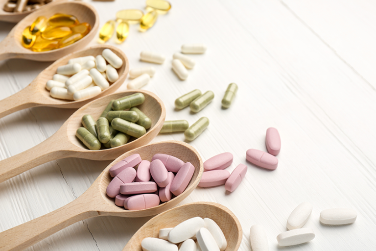 different vitamin capsules spoons different vitamin capsules spoons