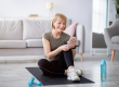 fit senior woman relaxing yoga mat