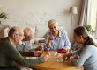 group of four cheerful senior people