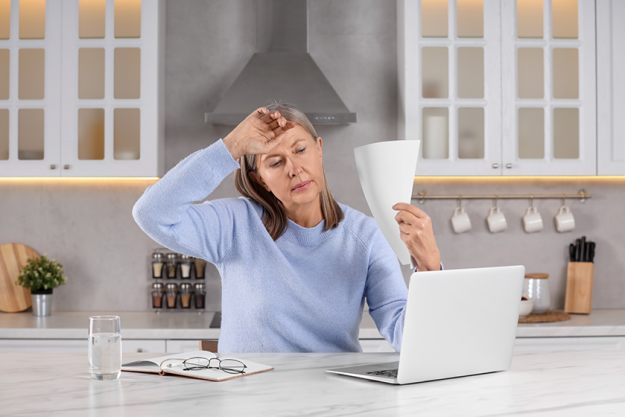 menopause woman waving paper sheet