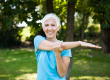 senior woman exercising tretching arm