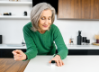 woman using oximeter for measures the oxygen saturation