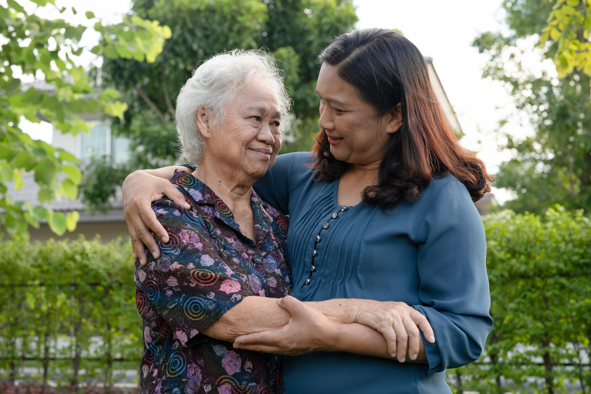 Asian elderly woman hug with her daughter with love, care, help,